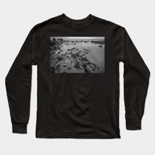 Seaweed covered rocks in a shallow tide pool on the Norfolk coast Long Sleeve T-Shirt